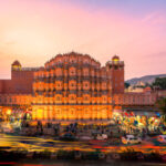 Jaipur - December 15, 2017: The crowd and vehicles in front of Hawa Mahal, India at the evening.