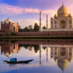 Taj Mahal is a white marble mausoleum on the banks of the Yamuna river built by Mughal Emperor Shah Jahan. A UNESCO World Heritage site at Agra, India. Photograph taken from Mehtab Bagh.