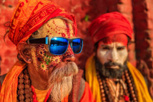 In Hinduism, sadhu, or shadhu is a common term for a mystic, an ascetic, practitioner of yoga (yogi) and/or wandering monks. The sadhu is solely dedicated to achieving the fourth and final Hindu goal of life, moksha (liberation), through meditation and contemplation of Brahman. Sadhus often wear ochre-colored clothing, symbolizing renunciation.